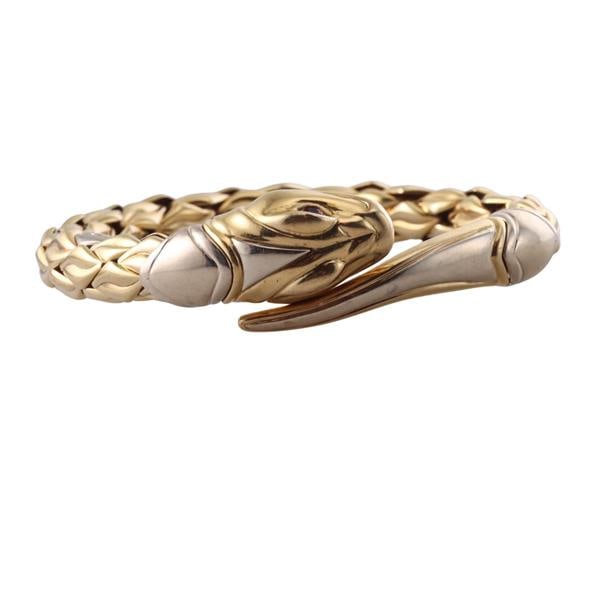 Chimento 18k Gold Ruby Snake Cuff Bangle Bracelet: METAL: 18k Gold. GEMSTONES: Ruby eyes. MEASUREMENTS: Bracelet will fit up to 8" wrist and is 19.2mm at widest point. MARKED: Chimento 750 MOD DEP, Star mark 408VI. WEIGHT: 55 grams.Gemstones have