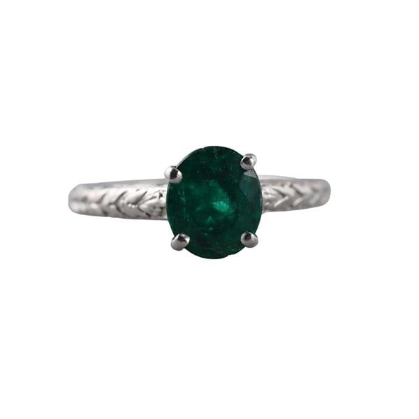 Platinum Emerald Engagement Ring: METAL: Platinum. GEMSTONES: Emerald (stone is chopped). MEASUREMENTS: Ring size 5 3/4, top is 8.6mm. MARKED: Plat. WEIGHT: 6.1 grams.Gemstones have not been graded for color and clarity, and tested fo