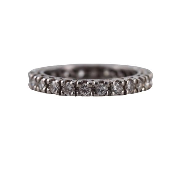 Platinum Diamond Eternity Wedding Band Ring: METAL: Platinum. MEASUREMENTS: Ring size 7, ring is 3mm wide. GEMSTONES: Diamonds approx. 1.20ctw. TESTED: Plat. WEIGHT: 4.8 grams.Gemstones have not been graded for color and clarity, and tested for