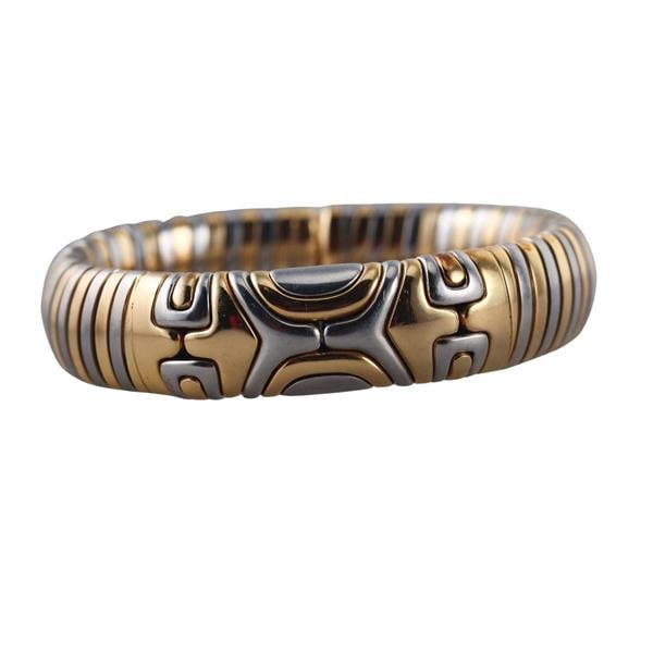 Bvlgari Bulgari Tubogas 18k Gold Steel Bracelet: METAL: 18k Gold and Stainless Steel. MEASUREMENTS: Bracelet will fit 7" wrist and is 15.5mm wide. MARKED: 750 Bvlgari Star mark 2337AL, Ur et Acian. WEIGHT: 64.1 grams.Gemstones have not been gra