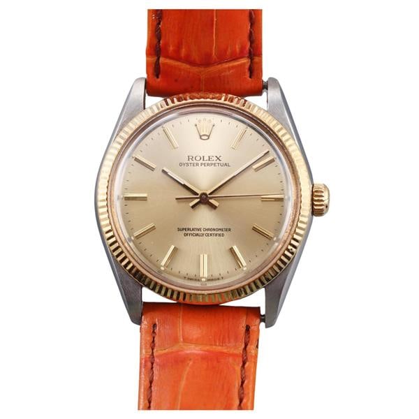 Rolex Oyster 18k Gold Bezel Steel Watch 1005: METAL: 18k Gold Bezel/ Stainless Steel. MEASUREMENTS: Case 34mm, band and buckle not original. Champagne dial with stick markers. MOVEMENT: Automatic, working order. Ref. 1005, Ser # R793***. Circa 19