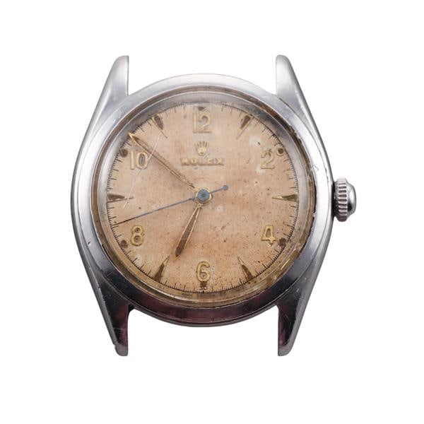 Rolex Precision 1950s Steel Watch 6022: METAL: Stainless Steel. MEASUREMENTS: Case 33mm, no band. Significant discoloration/damage on the dial. Fracture and scratches on the crystal. Fair cosmetic condition. MOVEMENT: Automatic, working ord