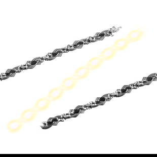 18k Gold Diamond Tanzanite Bracelet: METAL: 18k Gold. GEMSTONES: Diamonds approx. 0.50ctw. Tanzanite. MEASUREMENTS: Bracelet is 7.5" long x 14.4mm wide. MARKED: Maz 18k. WEIGHT: 42.4 grams. Gemstones have not been graded for color a