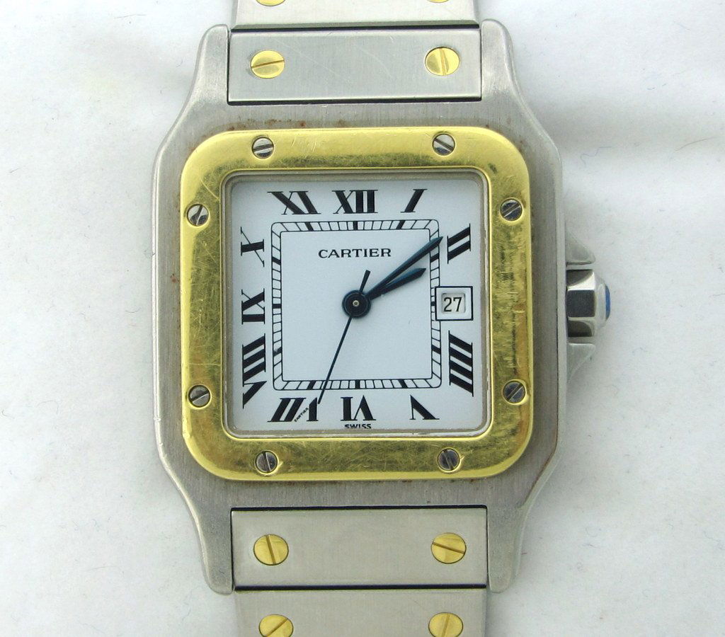 Cartier Santos Steel 18K Gold Automatic Watch: 18K yellow Gold and Steel case with steel and gold bracelet. Automatic movement. Center Second hand , date window at 3 o'clock. Case ,Dial and Movement signed. Original sapphire crown.