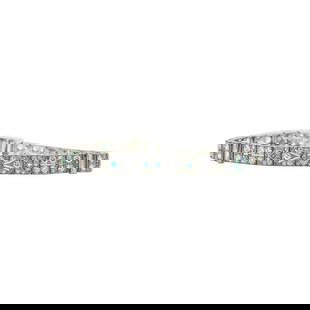 Art Deco Platinum Diamond and Emerald Bracelet: METAL: Platinum. GEMSTONES: Diamonds approx. 4.85 ctw, Emeralds, three emeralds missing and one chipped. MEASUREMENTS: Length 7 inches, width 6mm. MARKED: 10% Plat Irid. WEIGHT: 23.1 grams.