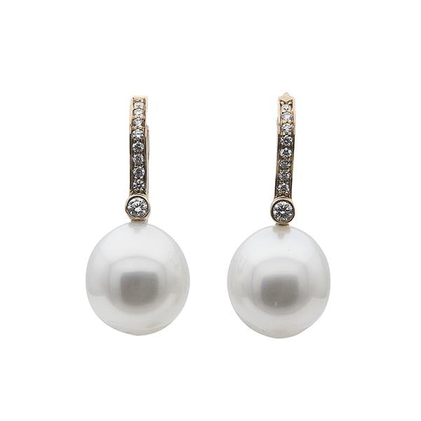 A Pair of Tiffany & Co. 18k Rose Gold Pearl and Diamond Earrings: METAL: 18k Rose Gold. GEMSTONES: Diamonds approx. 0.14 ctw, Pearls measuring approx. 11.2mm x 12mm. MEASUREMENTS: Length 16mm. MARKED: T&Co., Au750. Comes with box and pouch. WEIGHT: 6 grams. Gems