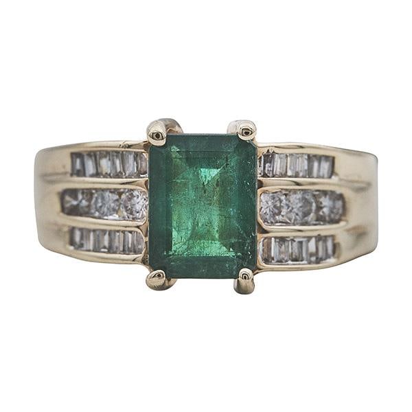 14k Yellow Gold Emerald and Diamond Ring: METAL: 14k Yellow Gold. GEMSTONES: Emerald measures 8mm x 6mm x 4.3mm, Diamonds approx. 0.40 ctw. MEASUREMENTS: Size 5 1/2, top width 8mm. MARKED: 14kt, RJM. WEIGHT: 5.1 grams. Gemstones have not been