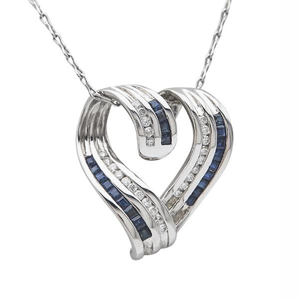 14k White Gold Diamond and Sapphire Heart Pendant Necklace: METAL: 14k White Gold. GEMSTONES: Diamonds approx. 0.26 ctw, Sapphires. MEASUREMENTS: Necklace length 16 inches, pendant is 27mm x 24mm. MARKED: 14, 585, Italy, maker's mark. WEIGHT: 9.9 grams. Ge