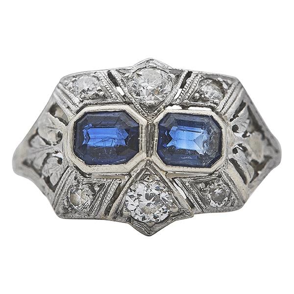 Art Deco Platinum Sapphire and Diamond Ring: METAL: Platinum. GEMSTONES: Diamonds approx. 0.32 ctw, Sapphires. MEASUREMENTS: Size 6 1/2, top width 12mm. TESTED: Platinum. WEIGHT: 3.2 grams. Gemstones have not been graded for color and clarity, a