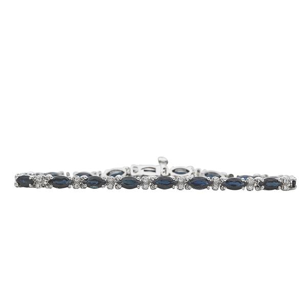 14k White Gold Alternating Sapphire and Diamond Tennis Bracelet: Diamonds weighing approx. 0.36 ctw. Bracelet length 6 3/4 inches. Stamped 14K, maker's mark. 9.6 grams. Gemstones have not been graded for color and clarity, and tested for clarity and color enhan