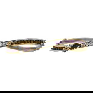 18k Yellow Gold Diamond and Ruby Hinged Bangle Bracelet: Diamonds weighing approx. 0.85 ctw. Bracelet fits approx. 6 1/4 inch wrist. Stamped 750. 25 grams. Gemstones have not been graded for color and clarity, and tested for clarity and color enhancement, u
