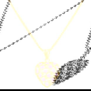 14k Yellow Gold Ruby and Sapphire Reversible Heart Pendant Necklace: Necklace length 15 3/4 inches. Pendant stamped 14k, VD. Chain stamped 14KT, RJ. 4.6 grams. Gemstones have not been graded for color and clarity, and tested for clarity and color enhancement, unless st