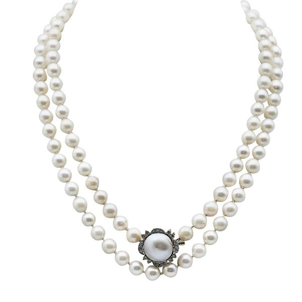 Single Strand Akoya Pearl Necklace with 14k Yellow Gold Diamond and Mabe Pearl Clasp: Diamonds weighing approx. 0.30 ctw. Akoya pearls measuring approx. 7 - 7.5mm. Necklace length 35 inches. 62.8 grams. Gemstones have not been graded for color and clarity, and tested for clarity and co