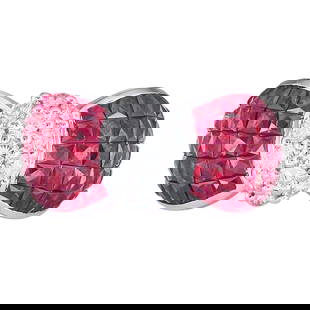 18K White Gold Invisible-Set Ruby and Diamond Bow Ring: METAL: 18K White Gold; APPROXIMATE TOTAL DIAMOND WEIGHT: 0.65 ctw; GEMSTONES: Ruby; STAMPED: 750; CONDITION: Pre-owned, Excellent; ITEM WEIGHT (GRAMS): 8 g; MEASUREMENTS: Ring size 7 1/4; Diamonds