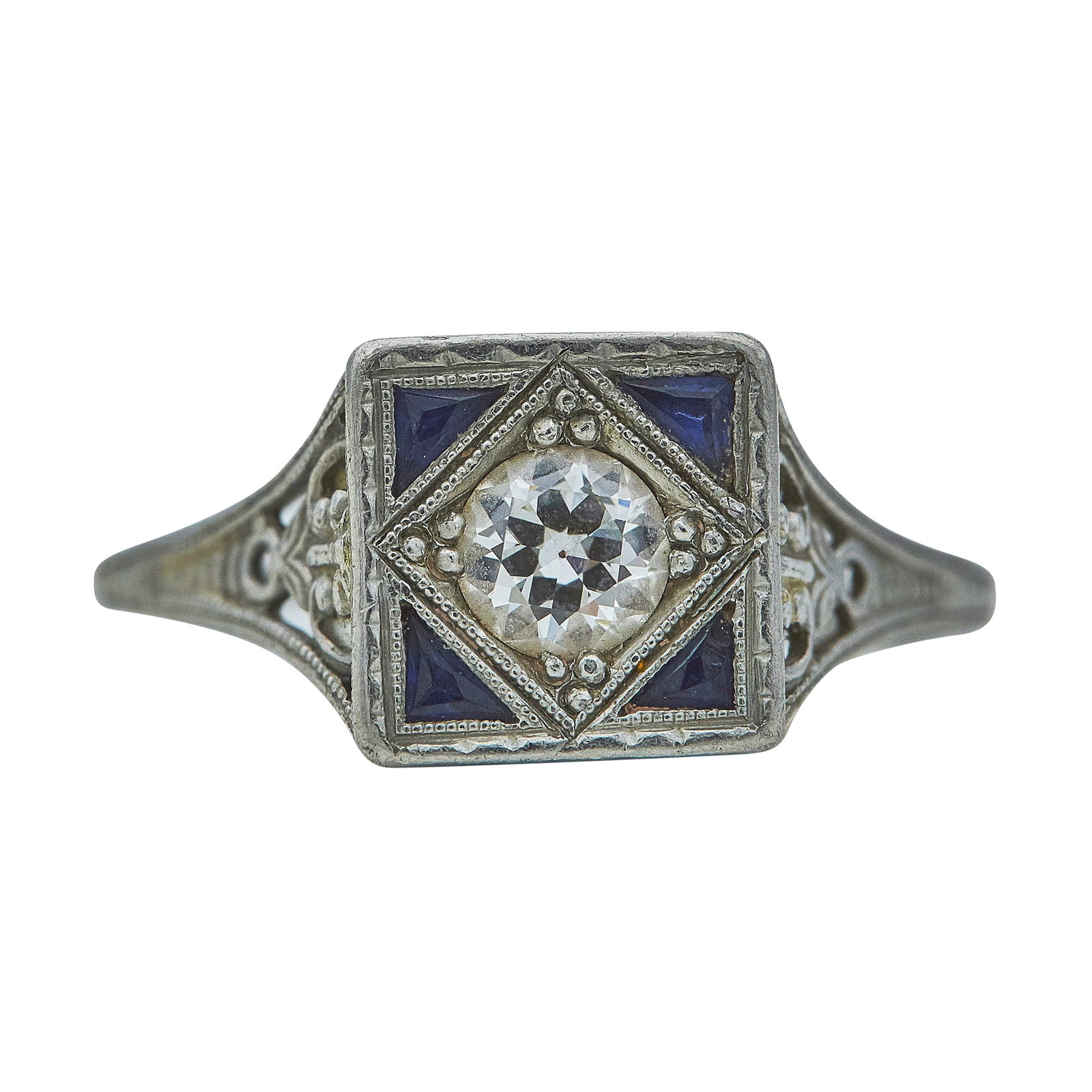 Vintage Platinum Diamond and Sapphire Engagement Ring: METAL: Platinum; APPROXIMATE TOTAL DIAMOND WEIGHT: 0.30 ctw; GEMSTONES: Sapphire, one sapphire chipped; TESTED: Platinum; CONDITION: Pre-owned, Good; ITEM WEIGHT (GRAMS): 3.3 g; MEASUREMENTS: Ring siz