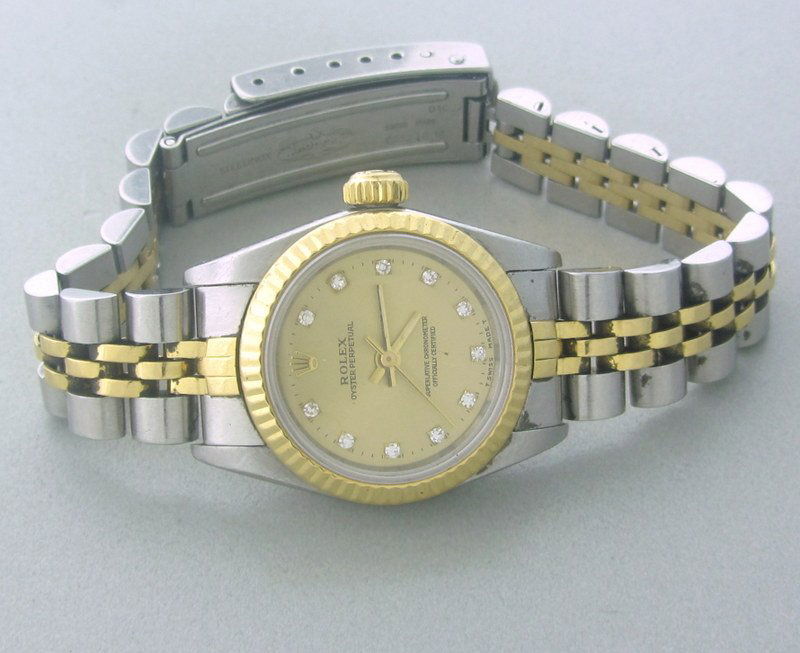 Rolex 18K Gold Steel Diamond Ladies Watch 67193: Rolex Oyster Perpetual 18k Gold Steel No Date Watch Ref# : 67193 Serial: E37#### Movement: Automatic. Bracelet: Jubilee. Dial: Champagne with Diamond markers covered. Crystal: Sapphire Bezel: Fluted