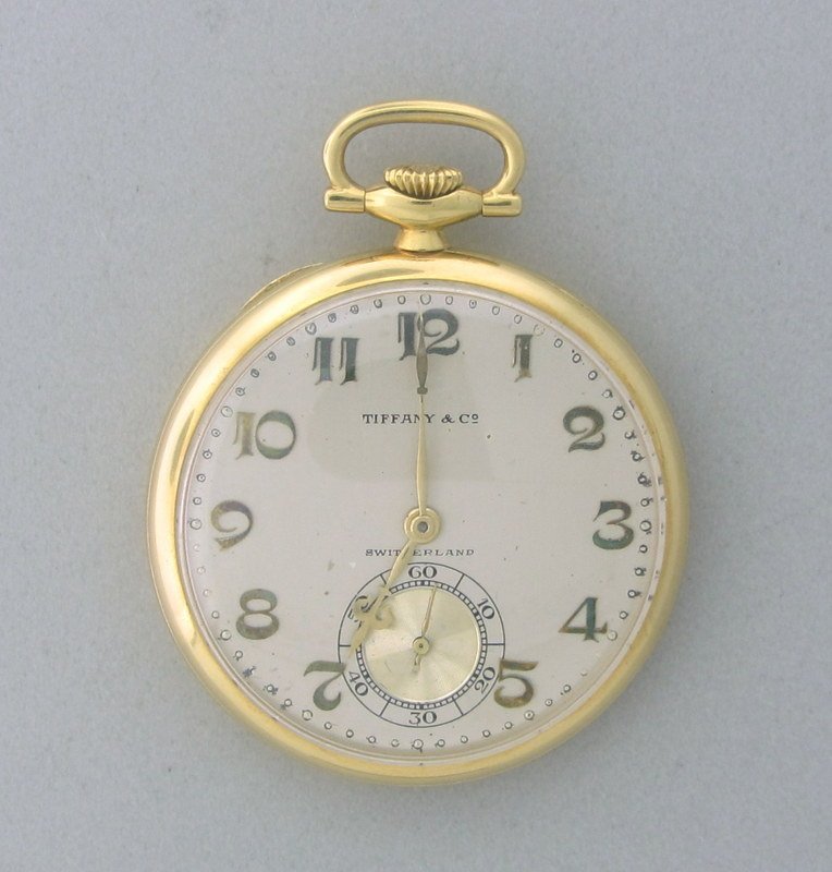 Tiffany & Co 18k Gold Pocket Watch 1920s: 18k gold open face 42mm in diameter, 19jewels movement 5 adj.Made for Tiffany by longines. applied gold Arabic hour markers triple signed.