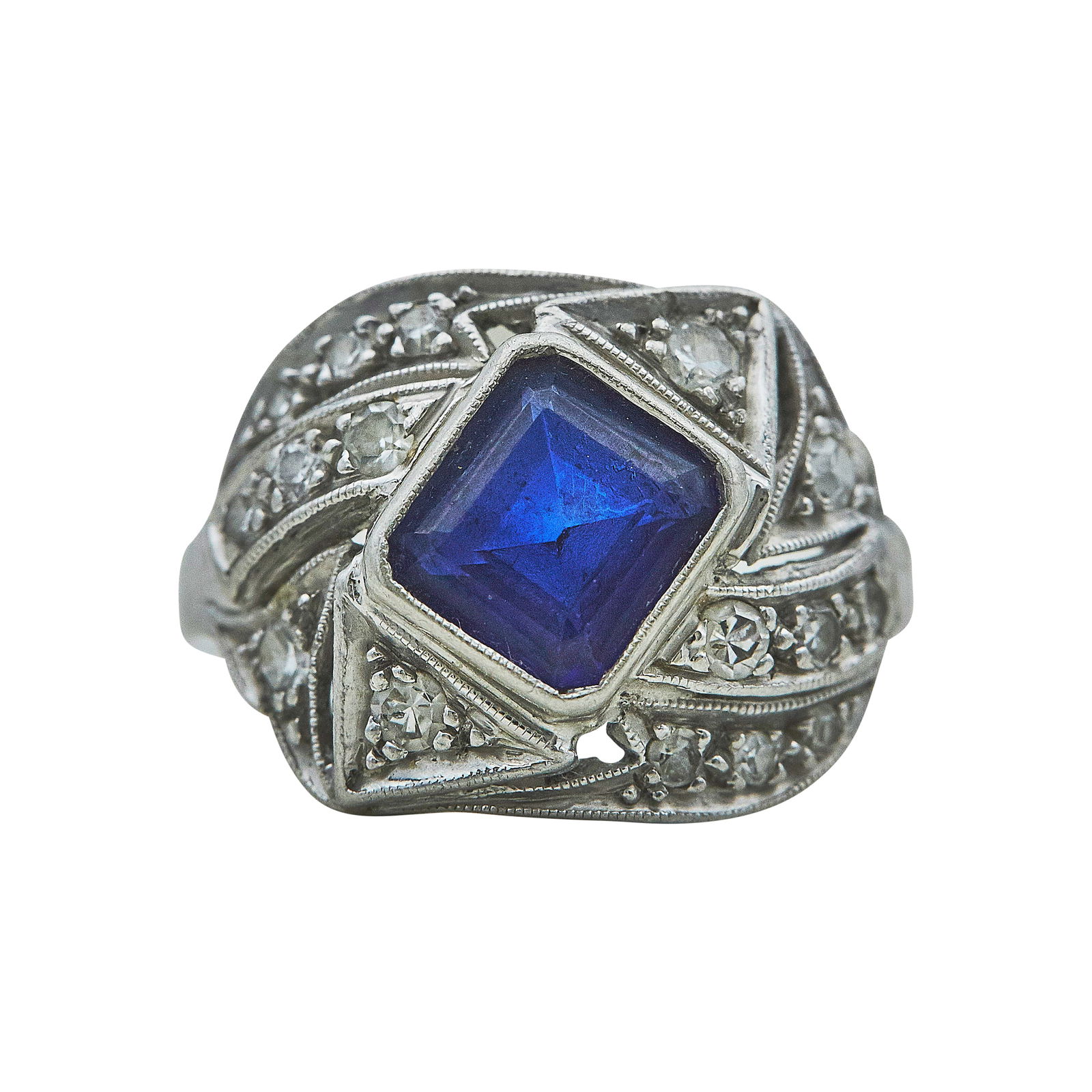 Vintage Platinum Step-Cut Sapphire and Diamond Ring: METAL: Platinum; APPROXIMATE TOTAL DIAMOND WEIGHT: 0.25 ctw; GEMSTONES: Sapphire weighing approx. 1.20 carats; STAMPED: 900 Plat 100 Irid; CONDITION: Pre-owned, Good; ITEM WEIGHT (GRAMS): 5.51 g; MEAS