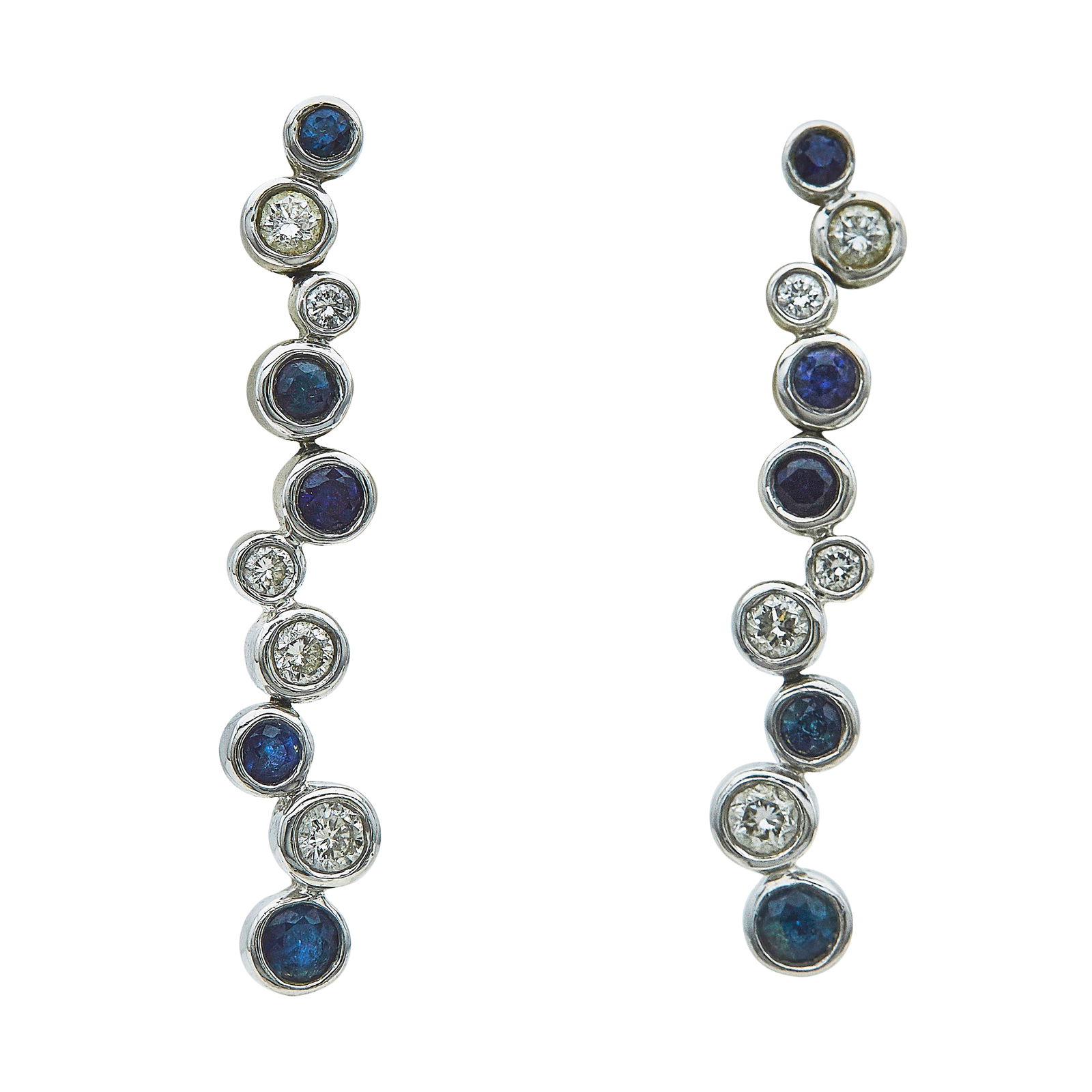 14K White Gold Bezel-Set Sapphire and Diamond Asymmetrical Drop Earrings: METAL: 14K White Gold; APPROXIMATE TOTAL DIAMOND WEIGHT: 0.54 ctw; GEMSTONES: Sapphires weighing approx. 0.50 ctw; STAMPED: 14KT, maker's mark; CONDITION: Pre-owned, Very Good; ITEM WEIGHT (GRAMS): 4.