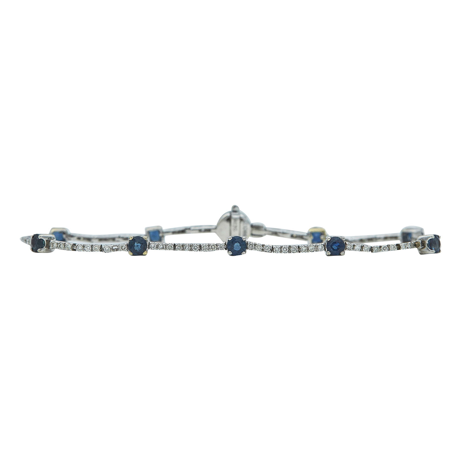 18K White Gold Sapphire and Diamond Tennis Bracelet: METAL: 18K White Gold; APPROXIMATE TOTAL DIAMOND WEIGHT: 0.95 ctw; GEMSTONES: Sapphires weighing approx. 1.35 ctw; STAMPED: D085, R176, K18; CONDITION: Pre-owned, Very Good; ITEM WEIGHT (GRAMS): 7.84
