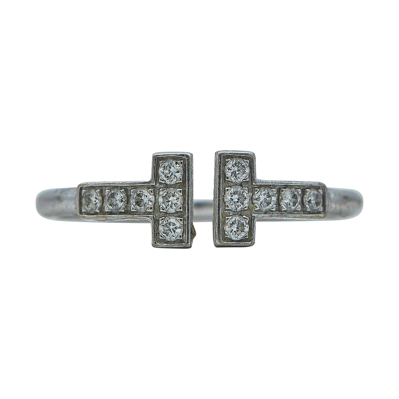 Tiffany & Co. Tiffany T 18K White Gold and Diamond Ring: BRAND: Tiffany & Co.; COLLECTION: Tiffany T; METAL: 18K White Gold; APPROXIMATE TOTAL DIAMOND WEIGHT: 0.18 ctw; STAMPED: © T & Co., Au750, ITALY; CONDITION: Pre-owned, Good; ITEM WEIGHT (GRAMS): 2.6
