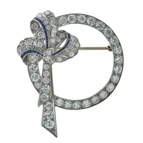 Art Deco Platinum, Diamond, and Calibre Cut Sapphire Circle Bow Brooch Pin