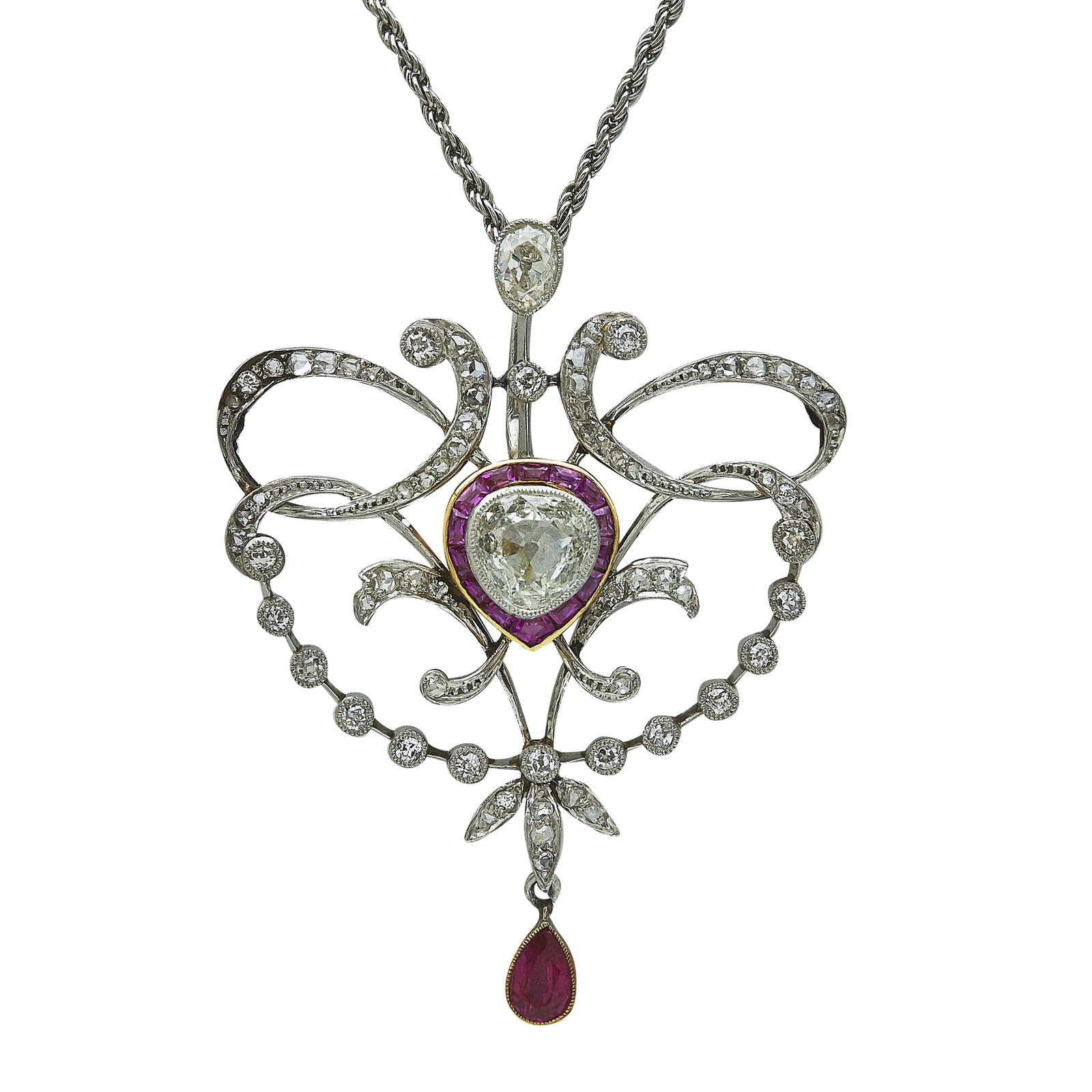 Edwardian Platinum and 18K Yellow Gold, Old Mine and Rose Cut Diamond, and Ruby Pendant Necklace: METAL: Platinum, 18K Yellow Gold; APPROXIMATE TOTAL DIAMOND WEIGHT: 1.54 ctw; GEMSTONES: Old pear cut diamonds weighing approx. 0.41 carat and 0.89 carat; STAMPED: Clap marked Pt850; CONDITION: Pre-ow