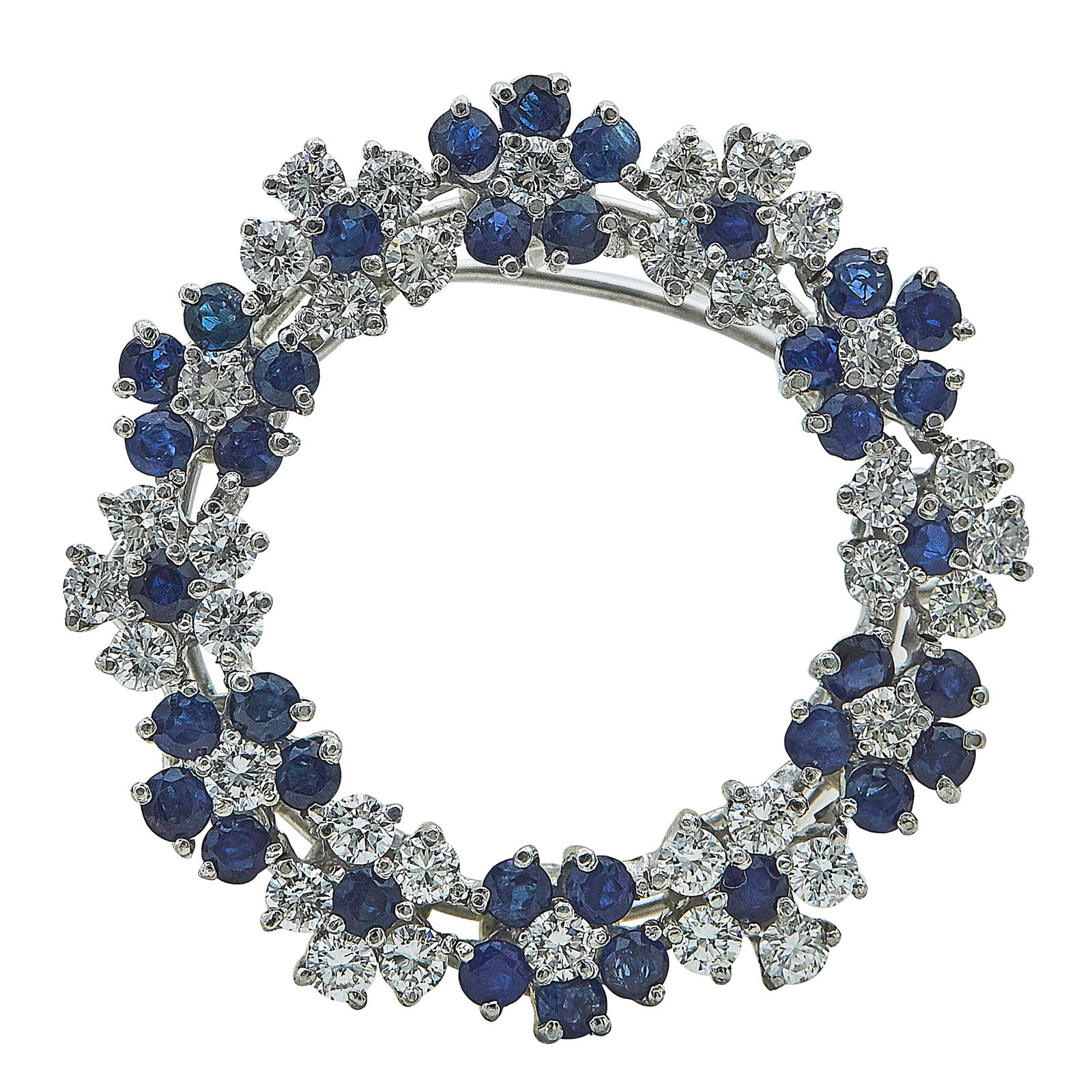 Platinum, Sapphire, and Diamond Flower Circle Brooch: METAL: Platinum; APPROXIMATE TOTAL DIAMOND WEIGHT: 2.16 ctw; TESTED: Platinum; CONDITION: Pre-owned, Very Good; ITEM WEIGHT (GRAMS): 12.9 g; MEASUREMENTS: Brooch 1 1/4 inch in diameter