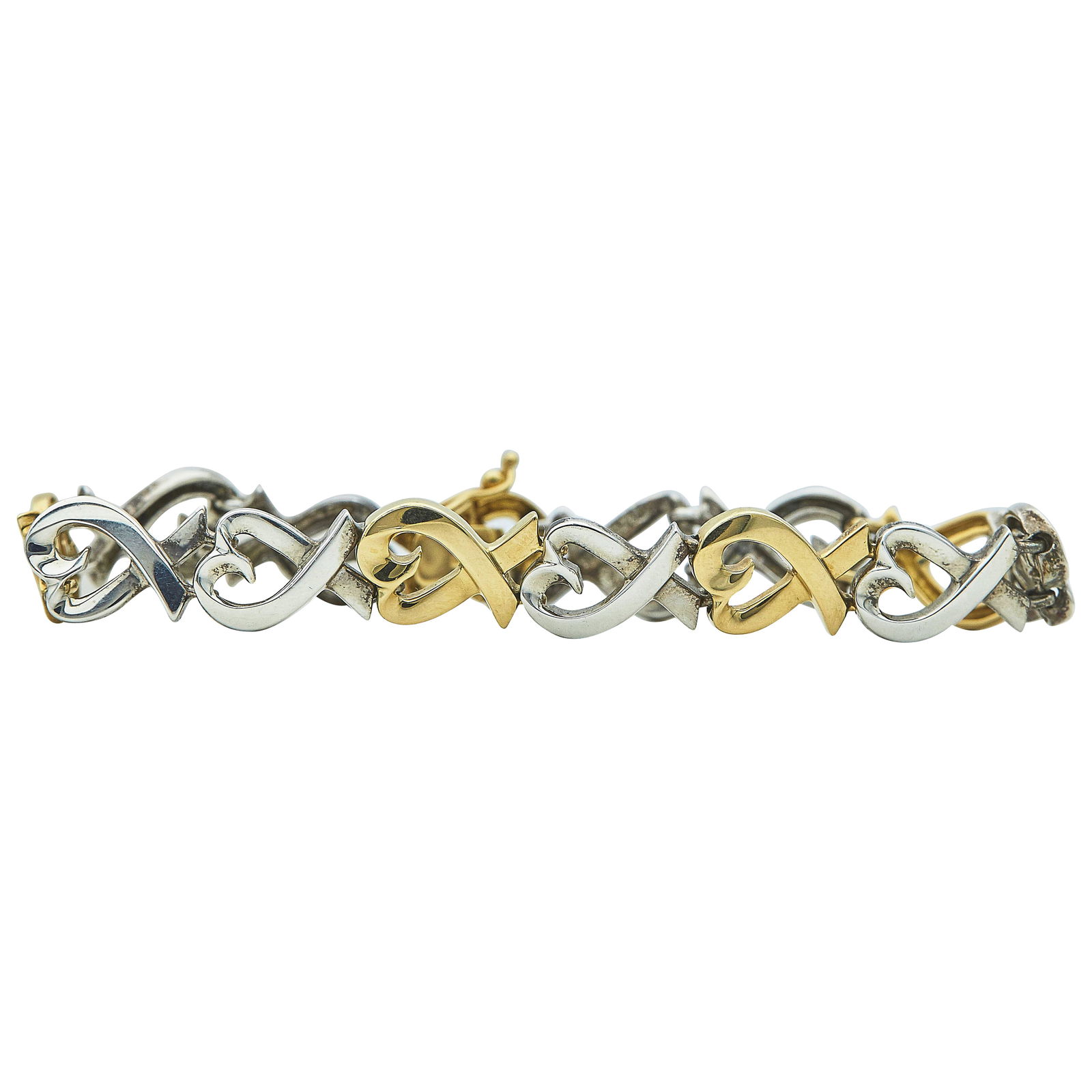 Paloma Picasso for Tiffany & Co. 18K Yellow Gold and Sterling Silver Heart Link Bracelet: BRAND: Paloma Picasso for Tiffany & Co.; METAL: 18K Yellow Gold/Silver; STAMPED: ©T&Co. Paloma Picasso 925, 750; CONDITION: Pre-owned, Very Good; ITEM WEIGHT (GRAMS): 20.3 g; MEASUREMENTS: Bracelet i