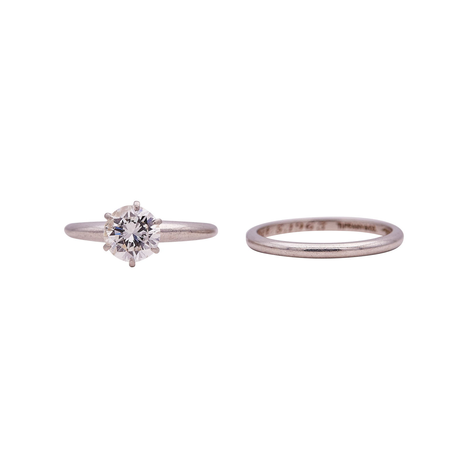 Tiffany & Co. Platinum and Diamond Engagement Ring & Band Set: BRAND: Tiffany & Co.; METAL: Platinum; APPROXIMATE TOTAL DIAMOND WEIGHT: 0.98 ctw; STAMPED: 100 IRID PLAT, TIFFANY & CO.; CONDITION: Pre-owned, Very Good; ITEM WEIGHT (GRAMS): 5.57 g; MEASUREMENTS: Ba