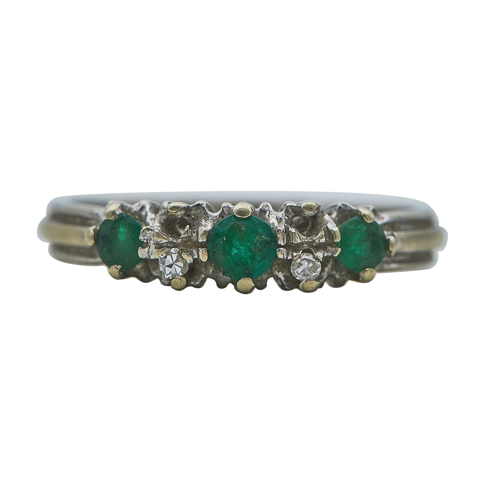 18K White Gold, Emerald, and Diamond Band Ring: METAL: 18K White Gold; APPROXIMATE TOTAL DIAMOND WEIGHT: 0.03 ctw; GEMSTONES: Emeralds chipped and abraded; STAMPED: 750; CONDITION: Pre-owned, Fair; ITEM WEIGHT (GRAMS): 3.29 g; MEASUREMENTS: Ring si