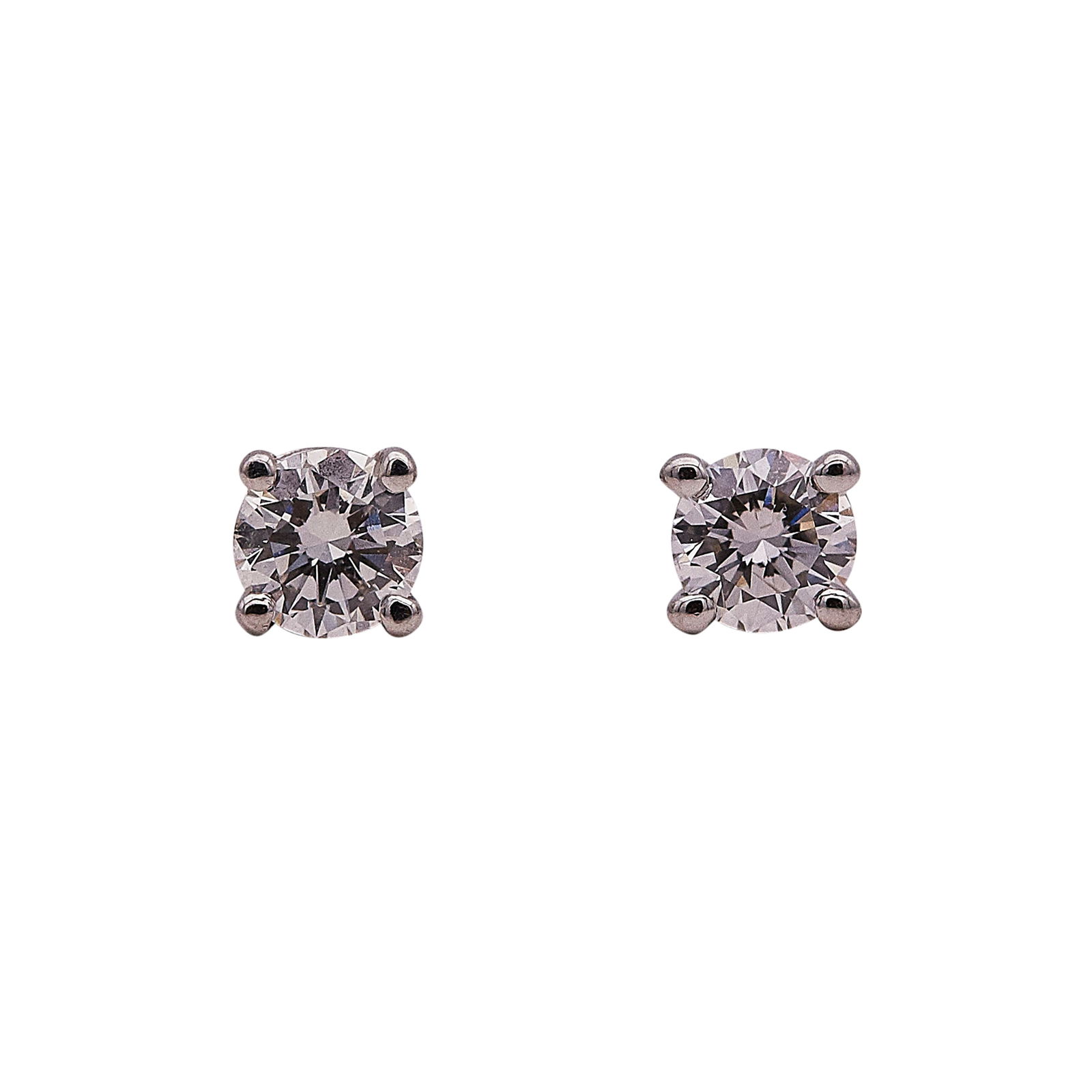 Tiffany & Co. Platinum and Diamond Stud Earrings: BRAND: Tiffany & Co.; METAL: Platinum; APPROXIMATE TOTAL DIAMOND WEIGHT: 0.22 ctw; STAMPED: Backs marked © T & Co., Pt950; CONDITION: Pre-owned, Very Good; ITEM WEIGHT (GRAMS): 1.27 g; MEASUREMENTS: