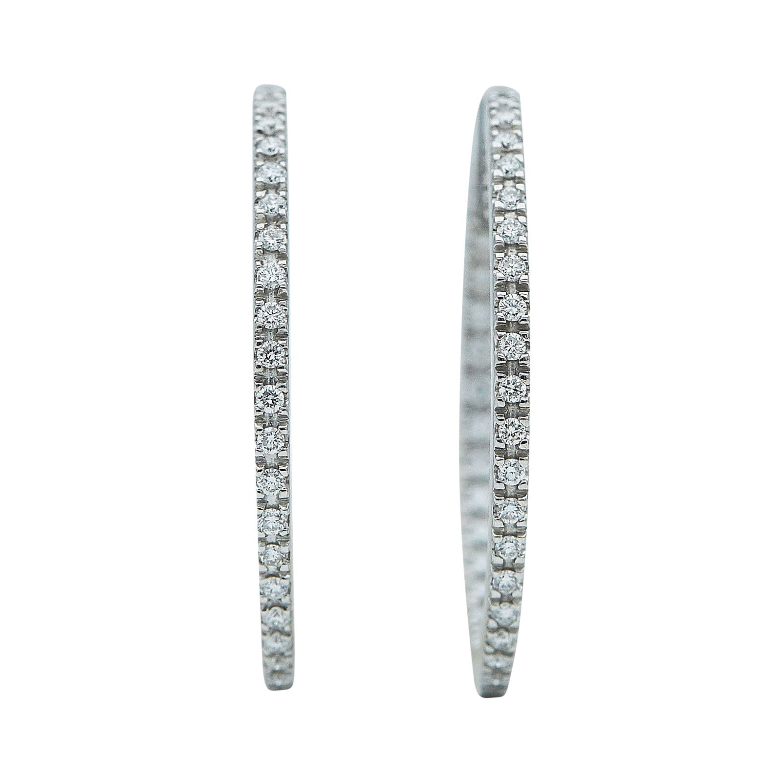 18K White Gold Inside-Out Diamond Hoop Earrings: METAL: 18K White Gold; APPROXIMATE TOTAL DIAMOND WEIGHT: 1.20 ctw; TESTED: 18K White Gold; CONDITION: Pre-owned, Good; ITEM WEIGHT (GRAMS): 9.2 g; MEASUREMENTS: Earrings measure approx. 1 3/8 inch in