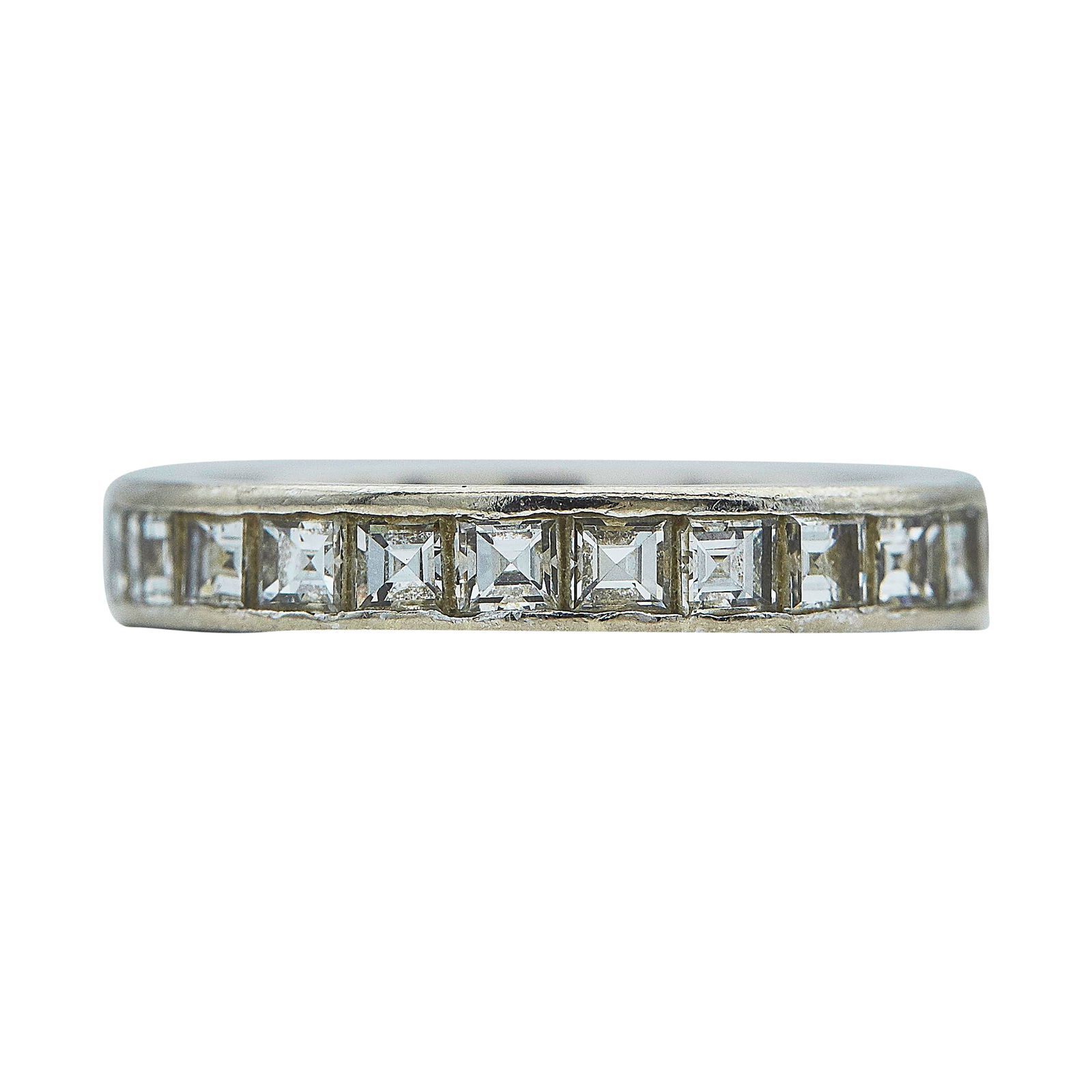 18K White Gold Square Cut Diamond Approx. 2.50 CTTW Eternity Band Ring: METAL: 18K White Gold; APPROXIMATE TOTAL DIAMOND WEIGHT: 2.50 ctw; TESTED: 18K White Gold; CONDITION: Pre-owned, Good; ITEM WEIGHT (GRAMS): 4.1 g; MEASUREMENTS: Ring size 7.5