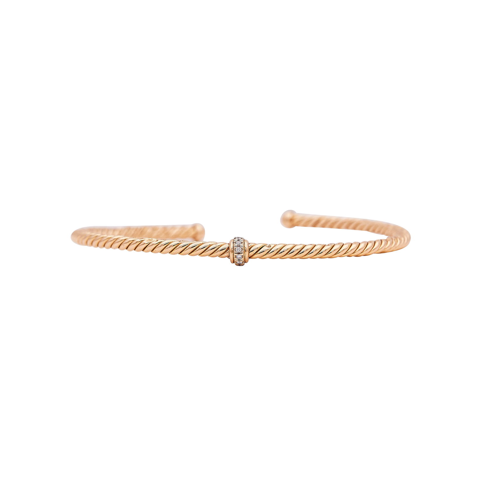 David Yurman Classic Cablespira 18K Rose Gold And Diamond Station Cuff Bracelet: BRAND: David Yurman; METAL: 18K Rose Gold; APPROXIMATE TOTAL DIAMOND WEIGHT: 0.03 ctw; STAMPED: D.Y. 750 (faded); CONDITION: Pre-owned, Good; ITEM WEIGHT (GRAMS): 6.9 g; MEASUREMENTS: Bracelet will fi