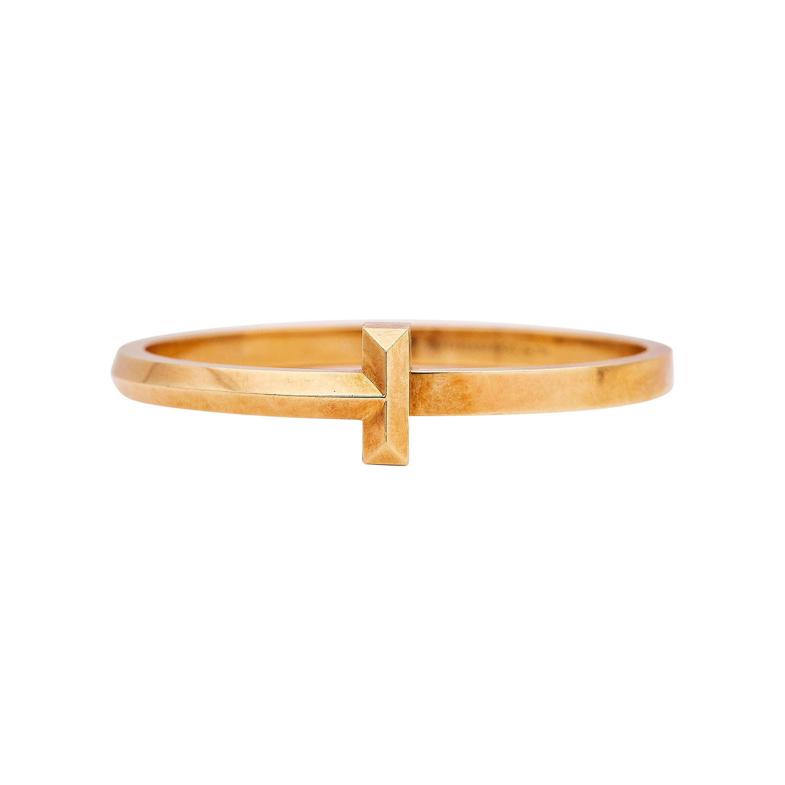 Tiffany & Co. Tiffany T 18K Yellow Gold Bangle Bracelet: BRAND: Tiffany & Co.; COLLECTION: Tiffany T; METAL: 18K Yellow Gold; STAMPED: © Tiffany & Co., Au750; CONDITION: Pre-owned, Good; ITEM WEIGHT (GRAMS): 32.3 g; MEASUREMENTS: Bracelet interior circumfe