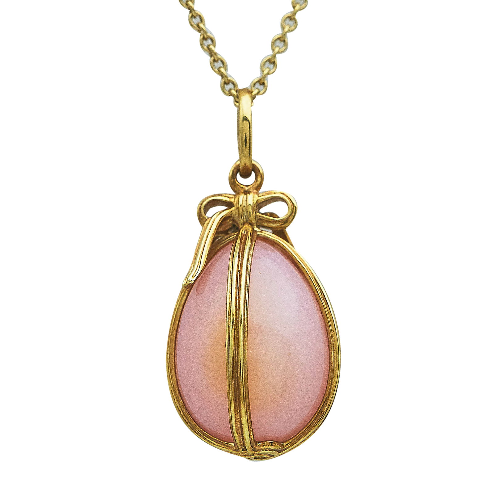 Tiffany & Co. Schlumberger Studios 18K Yellow Gold Opal Egg Pendant and Peretti Chain: BRAND: Tiffany & Co.; METAL: 18K Yellow Gold; GEMSTONES: Pink Opal; STAMPED: Pendant marked: © T & Co, Schlumberger Studios, Au750; Chain marked: © Peretti, SPAIN, TIFFANY & CO., 750; CONDITION: Pre