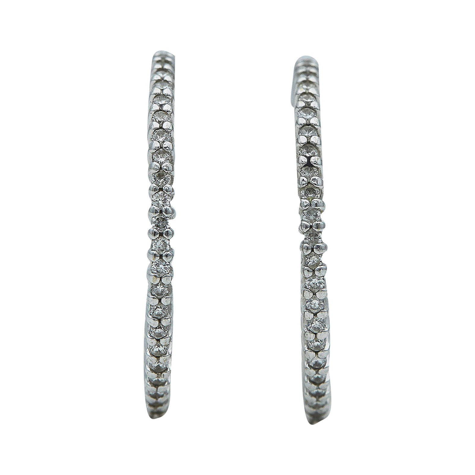 18K White Gold and Diamond Half-Hoop Earrings: METAL: 18K White Gold; APPROXIMATE TOTAL DIAMOND WEIGHT: 0.50 ctw; STAMPED: 18K; TESTED: 18K White Gold; CONDITION: Pre-owned, Very Good; ITEM WEIGHT (GRAMS): 5.9 g; MEASUREMENTS: Earrings 1 inch in d