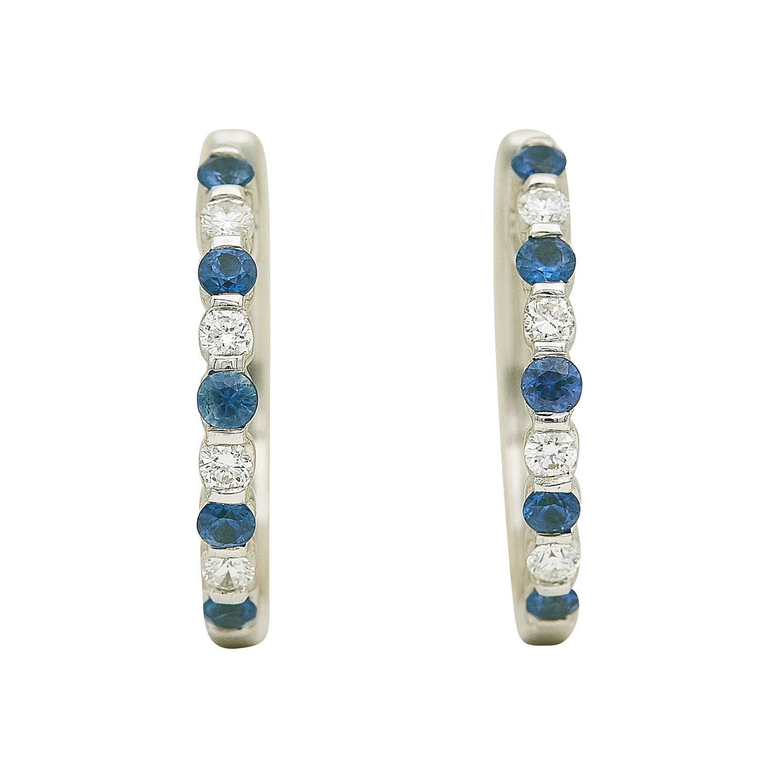 18K White Gold Sapphire and Diamond Earrings: METAL: 18K White Gold; APPROXIMATE TOTAL DIAMOND WEIGHT: 0.16 ctw; GEMSTONES: Sapphire; STAMPED: 18K P; CONDITION: Pre-owned, Very Good; ITEM WEIGHT (GRAMS): 4.81 g; MEASUREMENTS: Earrings 13/16 inch