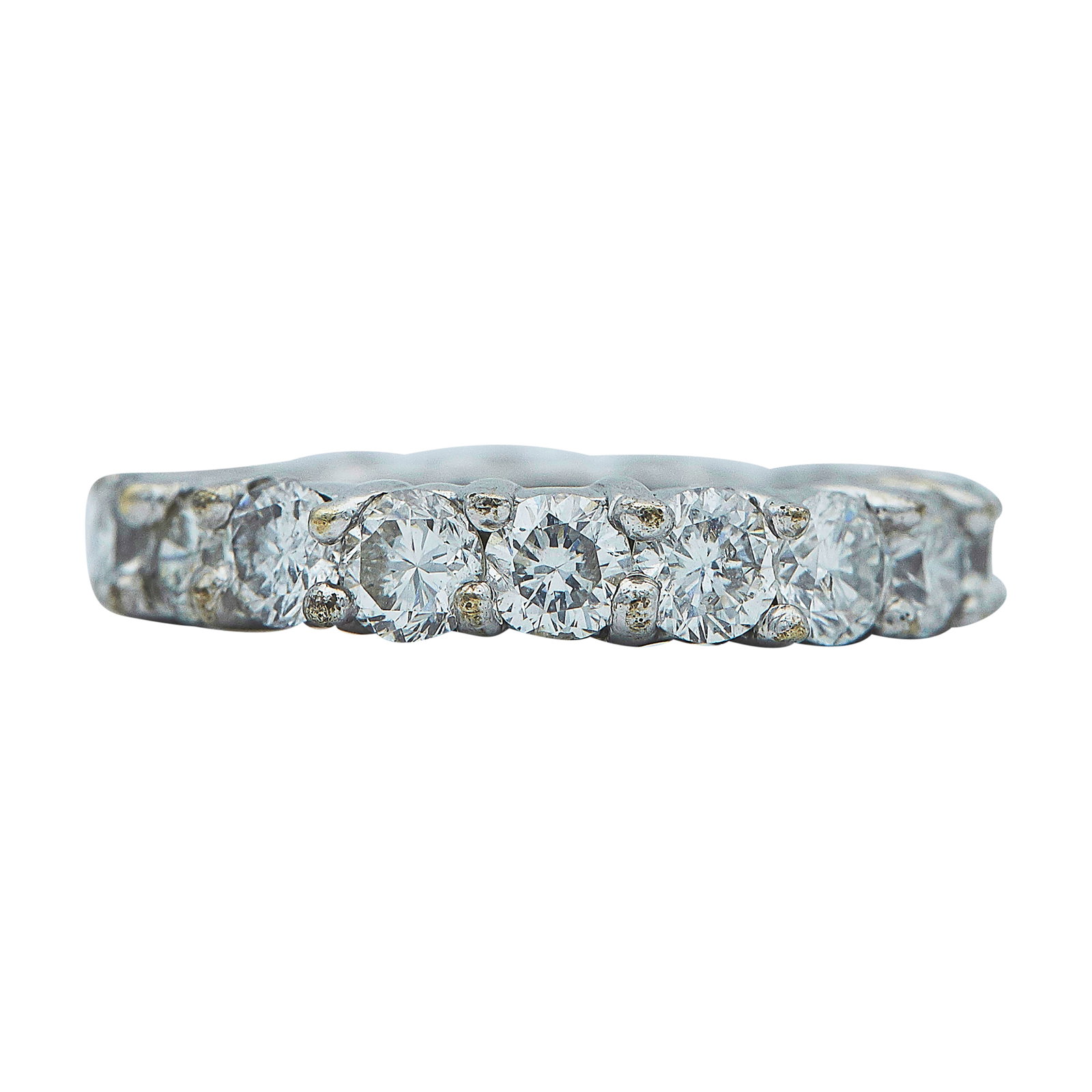 18K White Gold Diamond Approx. 2.70 CTTW Eternity Band Ring: METAL: 18K White Gold; APPROXIMATE TOTAL DIAMOND WEIGHT: 2.70 ctw; GEMSTONES: One simulant stone; STAMPED: 18K; TESTED: 18K White Gold; CONDITION: Pre-owned, Good; ITEM WEIGHT (GRAMS): 5.3 g; MEASUREM