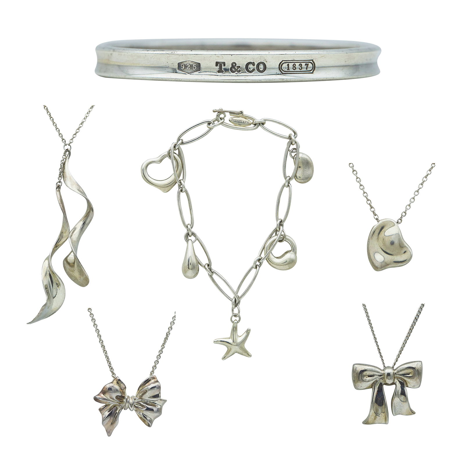 Lot of Tiffany & Co. Sterling Silver Including 4 Necklaces and 2 Bracelets: BRAND: Tiffany & Co.; METAL: Sterling Silver; STAMPED: Tiffany & Co., 925, Elsa Peretti, Gehry; CONDITION: Pre-owned, Very Good; ITEM WEIGHT (GRAMS): 72.3 g; MEASUREMENTS: Charm bracelet approx. 7 inc