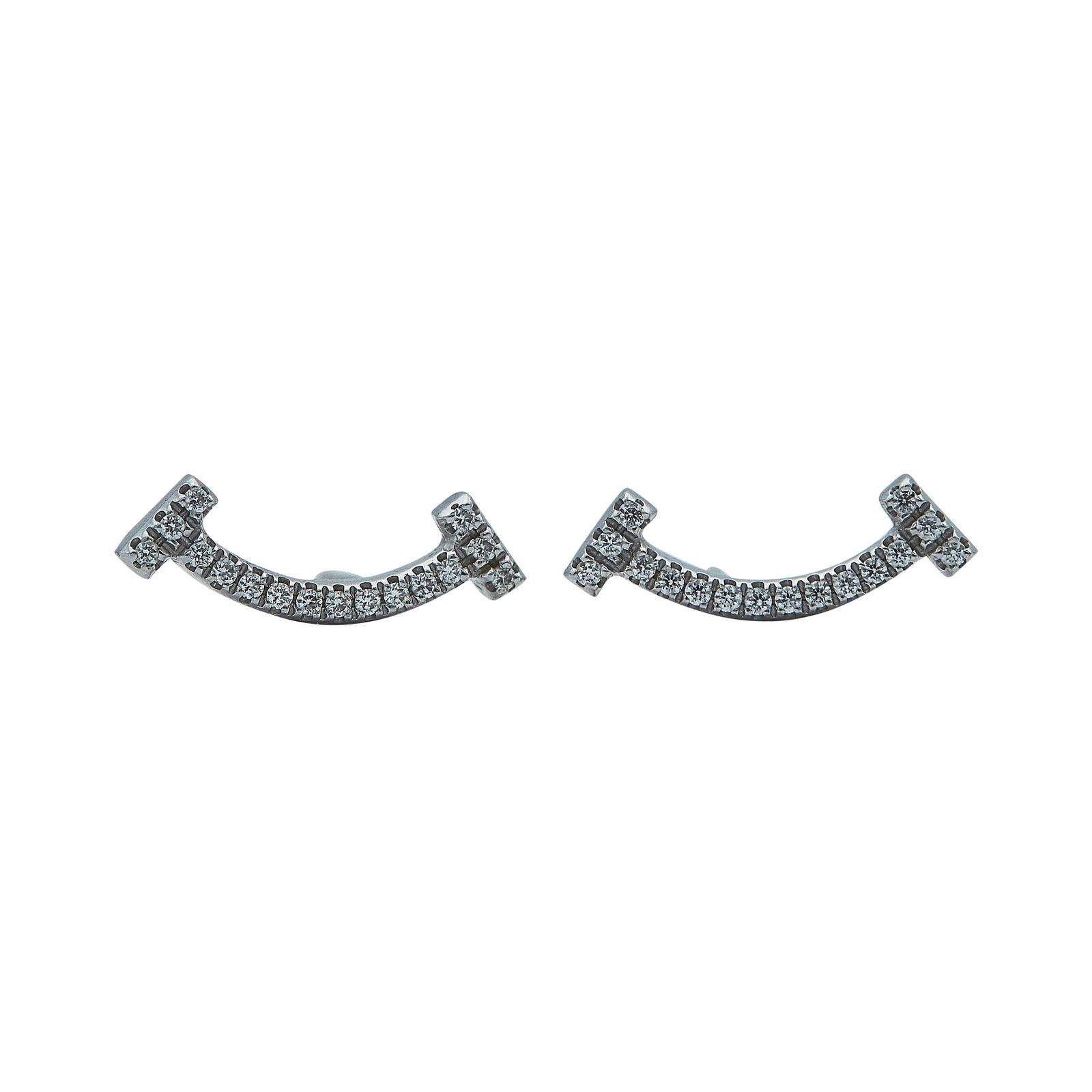 Tiffany & Co 18K White Gold Diamond T Smile Earrings: BRAND: Tiffany & Co.; COLLECTION: Smile; METAL: 18K White Gold; APPROXIMATE TOTAL DIAMOND WEIGHT: 0.60 ctw; STAMPED: T&Co., Italy; CONDITION: Pre-owned, Very Good; ITEM WEIGHT (GRAMS): 1.5 g