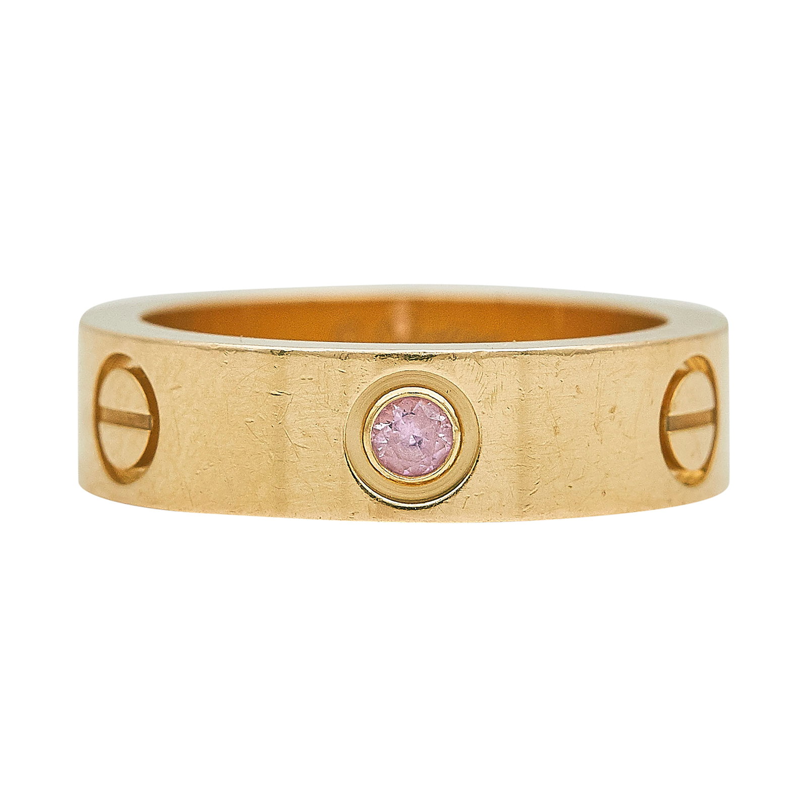 Cartier Love 18K Rose Gold And Pink Sapphire Band Ring: BRAND: Cartier; COLLECTION: Love; METAL: 18K Rose Gold; GEMSTONES: Pink Sapphire weighing approx. 0.05 carats; STAMPED: Cartier, 53, numbered, Au750, workshop mark; CONDITION: Pre-owned, Good; ITEM WE
