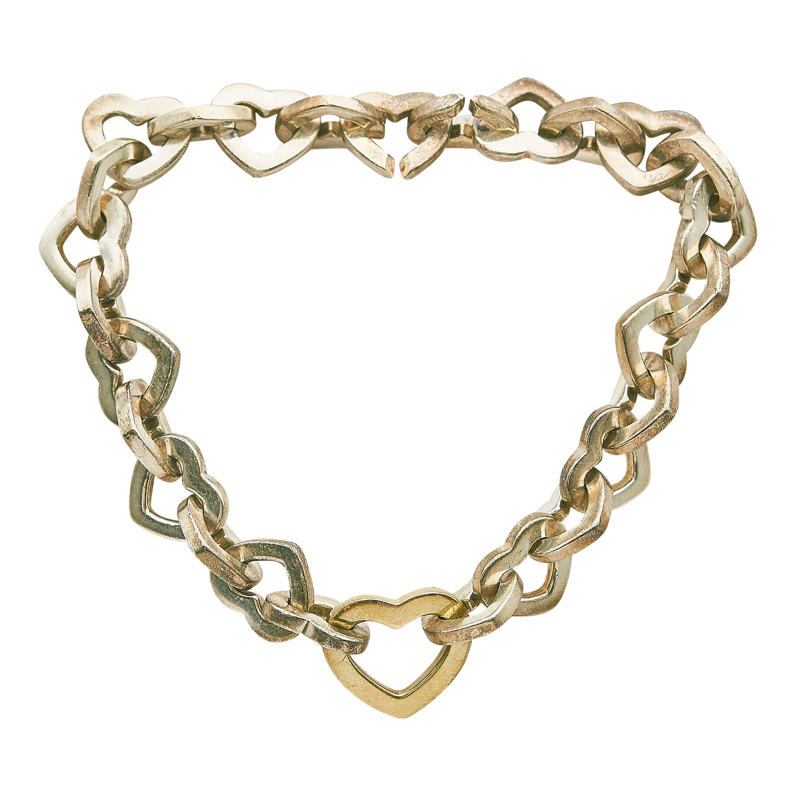 Tiffany & Co. Sterling Silver and 18K Yellow Gold Heart Bracelet: BRAND: Tiffany & Co.; METAL: Silver, 18K Yellow Gold; STAMPED: 975 750 Italy, Tiffany & Co., © 2001; CONDITION: Pre-owned; ITEM WEIGHT (GRAMS): 35.6 g; MEASUREMENTS: Bracelet 7 1/4 inches long