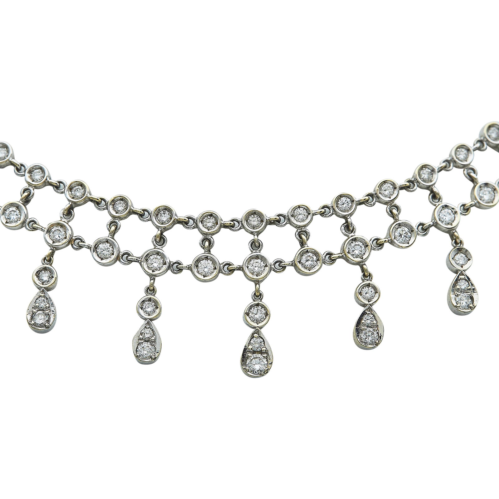 18K White Gold and Diamond Fringe Collar Necklace: METAL: 18K White Gold; APPROXIMATE TOTAL DIAMOND WEIGHT: 5.50 ctw; TESTED: 18K White Gold; CONDITION: Pre-owned, Very Good; ITEM WEIGHT (GRAMS): 40.3 g; MEASUREMENTS: Necklace 13 3/4 inches long