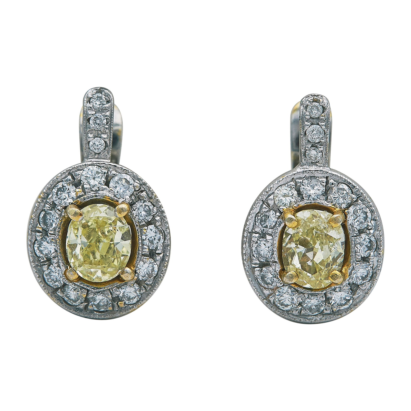Platinum and 18K Yellow Gold Diamond and Yellow Diamond Drop Earrings: METAL: 18K Yellow Gold/Platinum; APPROXIMATE TOTAL DIAMOND WEIGHT: 0.50 ctw; GEMSTONES: Yellow diamonds approx. 0.50 carat each; TESTED: 18K Yellow Gold/Platinum; CONDITION: Pre-owned, Very Good; ITEM