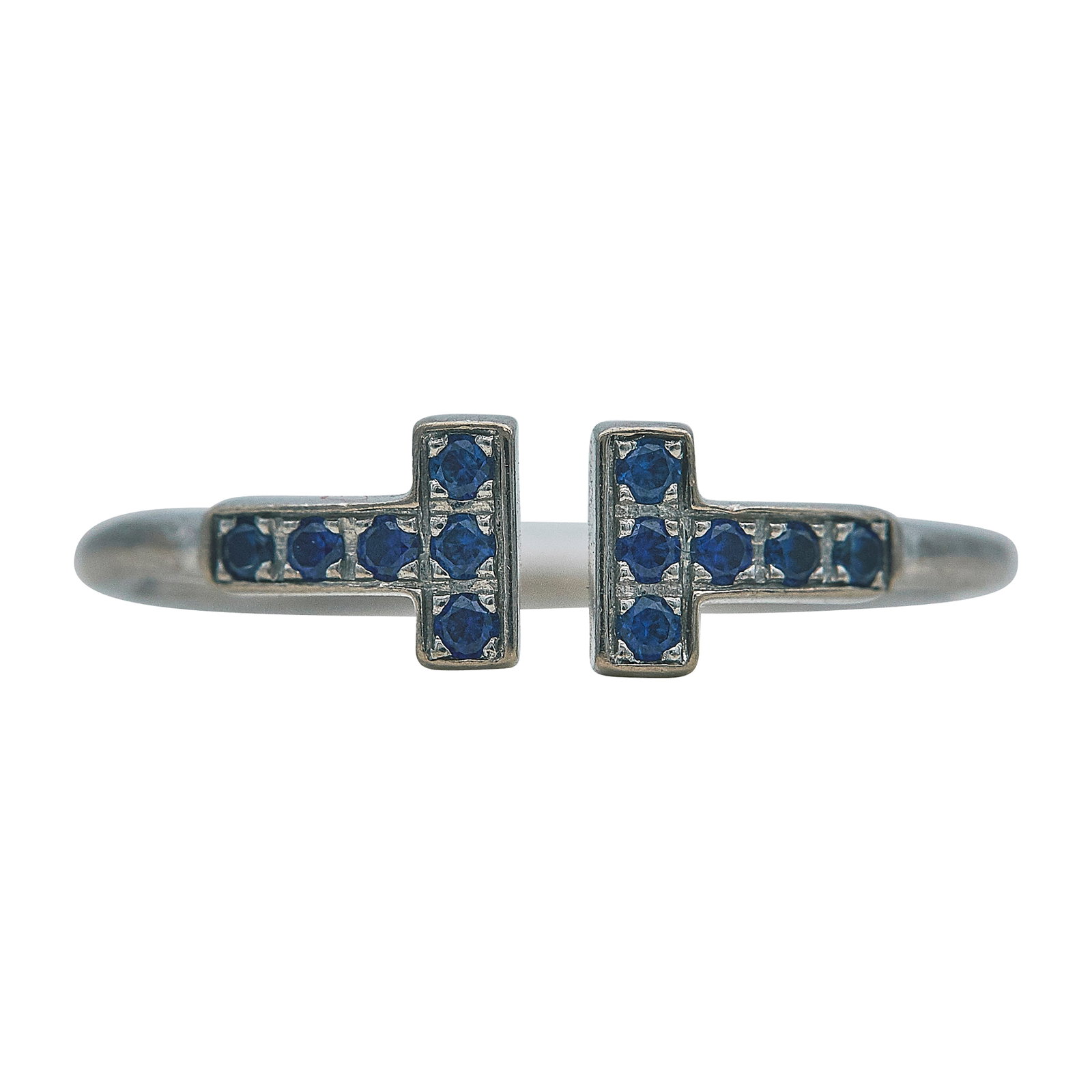 Tiffany & Co. Tiffany T 18K White Gold and Sapphire Ring: BRAND: Tiffany & Co.; COLLECTION: Tiffany T; METAL: 18K White Gold; GEMSTONES: Sapphire; STAMPED: © T & Co., Au750, ITALY; CONDITION: Pre-owned, Very Good; ITEM WEIGHT (GRAMS): 2.22 g; MEASUREMENTS: 