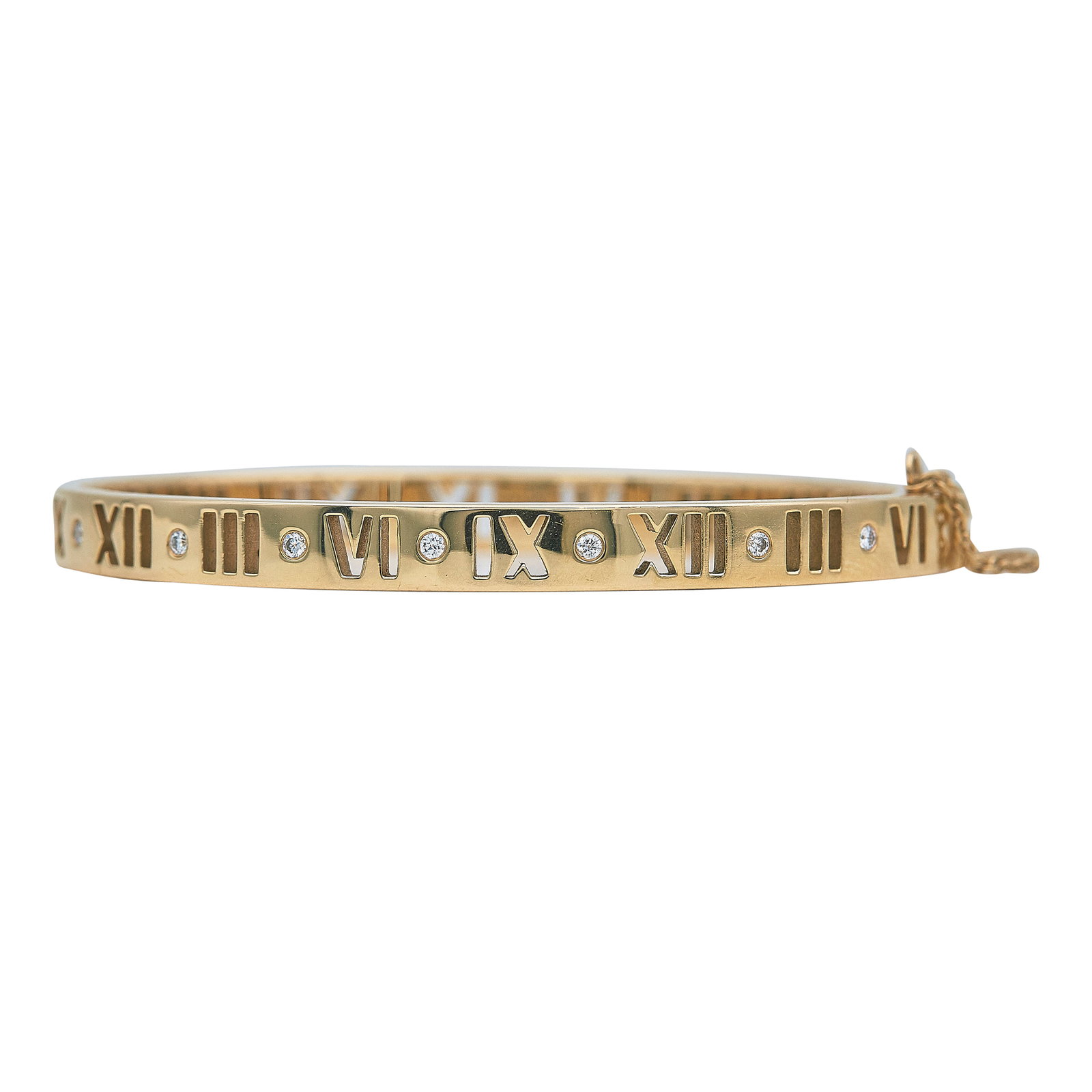 Tiffany & Co. Atlas 18K Yellow Gold and Diamond Hinged Bangle Bracelet: BRAND: Tiffany & Co.; COLLECTION: Atlas; METAL: 18K Yellow Gold; APPROXIMATE TOTAL DIAMOND WEIGHT: 0.14 ctw; STAMPED: © T&Co. Au750; CONDITION: Pre-owned, Good; ITEM WEIGHT (GRAMS): 28.2 g; MEASUREME