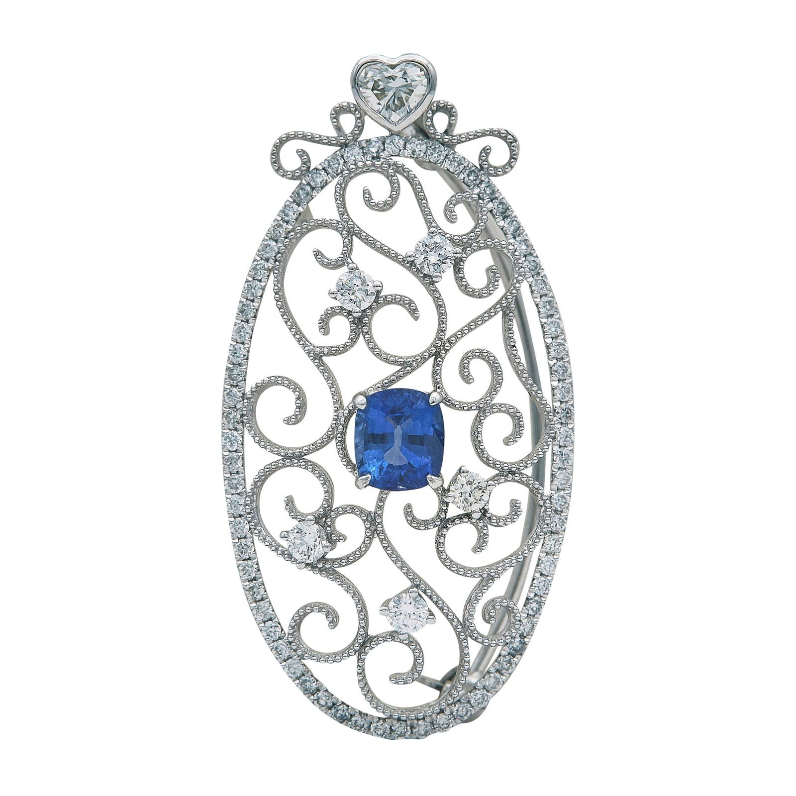 18K White Gold Sapphire and Diamond Pendant Brooch: METAL: 18K White Gold; APPROXIMATE TOTAL DIAMOND WEIGHT: 0.86 ctw; GEMSTONES: Sapphire approx. 0.96 carat, Weight estimated by formula; STAMPED: 750, S 0.96 ct, Heart 0.20 ct, D 0.68 ct; CONDITION: Pr