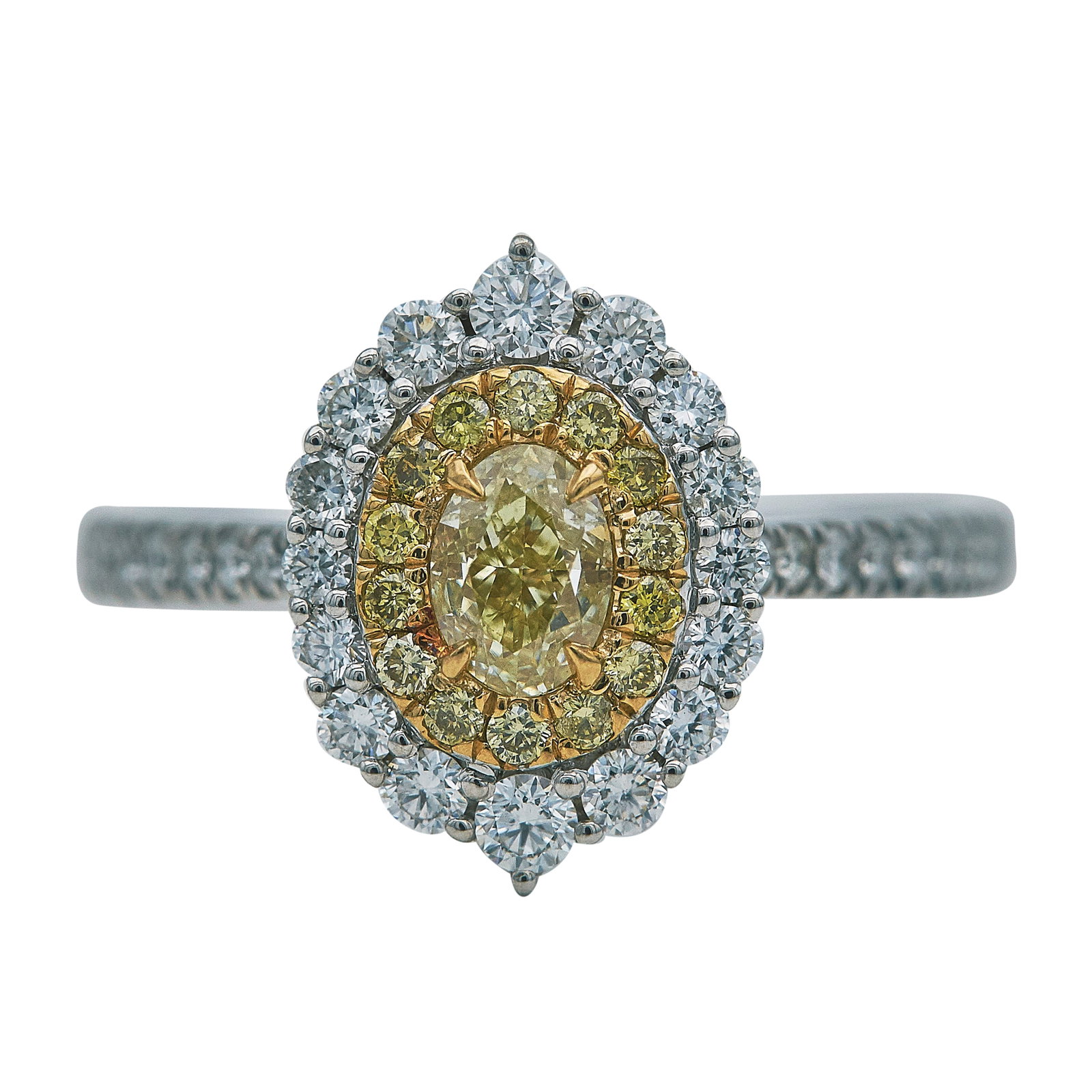 18K White Gold Yellow and White Diamond Halo Ring: METAL: 18K White Gold; APPROXIMATE TOTAL DIAMOND WEIGHT: 0.53 ctw; GEMSTONES: Center yellow diamond approx. total weight 0.63 carat; STAMPED: EK, G750, D0.506ct, d0.138ct, d0.534ct,; CONDITION: Pre-ow